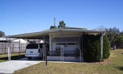 Located in Zephyr Shores mobile home subdivision just west of Zephyrhills, FL this 2 bedroom/2 bath mobile home is being sold furnished and ready for new owners.It is based on a split floor-plan and has a bedroom at each end, with an open center section
