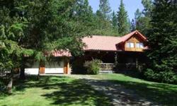Beautiful Custom Log Home on over 5 AC Backing BLM. Private & Quiet Well-Constructed Home, featuring Open & Spacious Living Areas, High Vaulted Ceilings, & Covered Front Porch. Climate Controlled Pantry Room. Matching Custom 20x16 Log Shop! Open Lawn