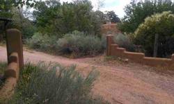 Beautiful adobe hacienda in the heart of Nambe! Perfectly located 20 minutes from Santa Fe or Los Alamos. Situated on 1 full acre with a 1 car garage and plenty of storage. Open concept displaying custom construction with a feng shui feeling. Radiant