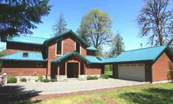 Custom mountain home built in 2003 & designed by award-winning architect James McGranahan. Large, level one-acre lot! Metal roofing, cedar siding, 2-car garage PLUS workshop! 6-panel doors, wood columns, tongue-in-groove soffits! Sun-filled 2-story entry