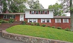 Charming split level overlooking beautiful Lake Hopatcong. This classic four bedroom features two and a half baths and a two car garage. The Main level offers you a formal dining room, large eat-in kitchen, three season sun room and a spacious living room