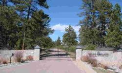 Beautiful Heavily wooded lot on Hole #2 at Bear Dance. Multiple build sites with views and privacy in this private gated community. Borders west side of Hole #2 and open space on the other side of lot. Ready to build your dream home. Easy access to I-25