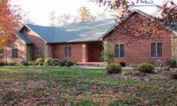 Rustic 4BR Lodge style home nestled in the woods. Large foyer leads to cath. wood ceilings,open living space,beautiful rock fireplace, sunroom all overlooks wooded back acreage. Large master suite with walk-in 9x11 closet, walk-in two headed shower,