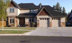 Custom, Custom, Custom lots of upgrades throughout this wonderful home.If your waiting for a home to just move into with quality throughout this is the one.From knotty alder cabinets, doors, moulding, granite countertops, large windowswith sound barrier