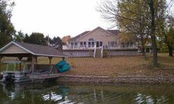 Beautiful waterfront home w/ approx 3000SF located on an ideal lot on the lake. The home is sitting just inside Plunder Cove & 1 house away from the full speed zone. This is a great location as you can enjoy the open water views but avoid the waves at