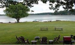 Direct waterfront, year round home with 50 feet of beach on Great Sacandaga Lake. Level lawn leads to waterfront. Four bedrooms, two full baths, and a third floor ready for additional sleeping space. Large great room featuring a kitchen with stove and