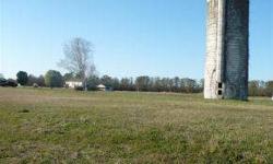 Waterfront lot is cleared with over 100 ft of waterfront. Old, Vintage silo adds lots of character. Owner financing is available for qualified buyers. Bay Lake has permits to open to Pamlico River. Great opportunity for buyer to buy this at a low price!