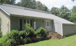 Great investment opportunity! Location, location, location!!! This 4br 2.5ba home sits on an acre of land and is being sold with an already subdivided 1/2 acre lot which could be sold for a quick turn around! This home with a spacious and open floor plan