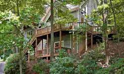 Enchanted wooded setting offering a charm that complements the environment! Vitality radiates from the fresh, sun filled rooms. Spacious, open floor plan with vaulted great room, fireplace and expansive multi level decking. Delightful master suite with