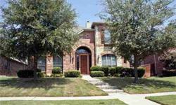 Impressive front curb appeal w the towering brick & stone exterior & mature trees. Designer touches include rich hardwood flooring, granite counters, sleek black appliances, arched doorways. Floorplan showcases spacious rooms-all bedrooms are generous in