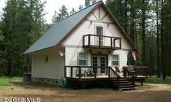 A private setting on a pine studded level 4.65 acre parcel in the heart of recreational paradise. This property borders Forest Service land with access to Nason Creek. Cabin has recently been turned into a very popular nightly rental, complete with hot