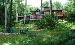 Northwoods charm of days gone by are relived in this rustic, log sided chalet situated on 3+ acres of wooded privacy on Roach Lake! Great Room concept Living, Dining, and Kitchen w/wood flooring punctuated with a Vermont Casting Wood stove & opens to the