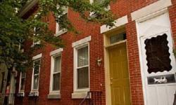 This lovingly restored 2BR, 1-1/2 bath home with rear yard is situated on a nice tree-lined block. Nice curb appeal with wide sidewalk, lovely tree, a handsome original brick facade, newer windows with wood shutters and marble steps. A vestibule leads