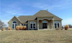 Gorgeous home ~ 60 acres - move-in ready! Quality 2x6 construction. Split bedrooms, 12' ceilings, stone fireplace & wood floors. Walkout lower level has second master suite, 2nd laundry room, full kitchen & living room. Wide doorways & halls.
Stucco