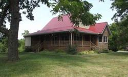 Thinking about getting away from the hustle and bustle of city life. Then this home is for you. This beautiful home was built in 1997. It sits on 13 acres bordering Stockton Lake, Missouri. Plentiful wildlife, deer and turkey abound. There are 5 large