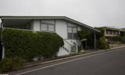AMAZING VALUE! 5 MINUTE WALK TO WESTWARD OR ZUMA BEACH, SERENE OCEAN & MOUNTAIN VIEWS FROM THIS 1,800 SQUARE FOOT 2 BDRM + DEN AND 2 BA, BEACH STYLE MOBILE HOME BUNGALOW, LOCATED IN THE 24 HOUR GUARD GATED PT. DUME CLUB. THE COMMUNITY AMENITIES INCLUDE A