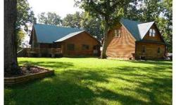 Hard to find Log Home 2beds 2/1bath in home and 2car Garage w/heated room and full bath on 10 acres! Beautiful porch with upper level deck. Hardwood floors, Carpet, and Tile on main. Great Kitchen with granite and dining area. Not to mention Dining room