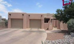 This Southwestern beauty sits in Laguna Estates walking distance (5 minutes) from Old Mesilla. The great room has Venetian plaster accents, high ceilings, fireplace, and is separated from the kitchen by a stunning 16' breakfast bar. The light open kitchen