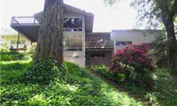 Mid-Century Modern split lvl hm in garden of green on prvt street in Laurel Springs Hts. Near Madrona Swim Club & Fircrest Park. Down the hill to S Courthouse & Minto Brown. Soaring entryway greets you in this 6 BR, 3.5 BA hm. Entertainers dream. Kit