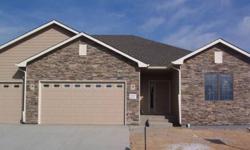 Delightful new 3 bedroom ranch style features 9' ft ceilings on main level and 9' ft ceilings in the basement. Knotty alder trim with 2 panel doors. Kitchen feautres Knotty adler 42' cabinets with granite and breakfast bar, gas range, convection oven,