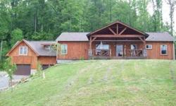 3/2 country home on approximately 5 acres with creek frontage. Oversized 2 car garage with In-law suite above. Full Basement with home theatre/game room. House is situated in established community 25 minutes north of Downtown Asheville. Additional land is