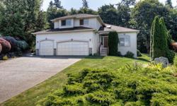 Don't miss out on this great resale in Garrison Creek! Located on just under an acre(.91)of gorgeously landscaped, private grounds that back to a green belt also includes a garden area & a 400 sq ft deck, partially covered for the NW Weather! This