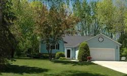 This 1330 sq ft finished home is in the Exclusive Country Club Beach Subdivision on Lake Michigan, in the town of Belgium, Wisconsin. This home is surrounded on three sides with wooded areas. The Subdivision deeded lake access is located directly in front