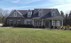 Custom home on 4 acres, with private rear yard, covered front/rear porches, foam insulation, upgraded HVAC, granite with under mount sinks in all baths, tile in Foyer, Laundry, back hall. Brick, siding, shake exterior. BR, exercise room, office w/2 beds/2