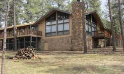 ENJOY THE SIERRA BLANCA VIEW THROUGH THE LARGE WINDOWS OR SIT BY THE BEAUTIFUL & MASSIVE ROCK FIREPLACE TO ENJOY THE GREAT ARCHITECTURAL QUALITIES & WOOD BEAMED CEILINGS OF THE GREAT ROOM. EXTERIOR HAS BEAUTIFUL MOSS ROCK ACCENTS, NICE DECKS & LAND HAS