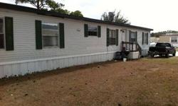 Large mobile home 4 bedroom 2 bath. New roof, new High efficiency A/C. Moving and set up included in the price.