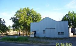 35000 8 acres with shop & barn & pond property has a well house used for washing cars and watering animals , city water , electric,natural city gas,phone and dsl high speed internet all on property land is ready for a house or trailer ,property is fenced