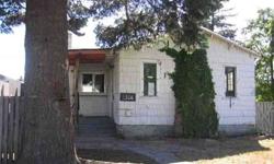 This HUD home has lots of potential! 2 bedroom, 1 bath with hardwood floors in the living room and tile floors in the bath. Home needs considerable work. Detached garage and greenhouse. Eligible for FHA financing with escrow repairs of $4950. Sold As Is .
