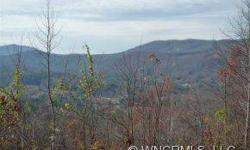 Spectacular views from this 1 acre lot in Rambling Hills subdivision, convenient to Hendersonville & Brevard. City water available, paved roads & underground utilities. This lot goes from street to street and is available as a package with lot #37 for a