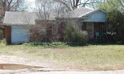 Extremely large lot with trees. House being sold "as is". Lot is potential for multiple homes.