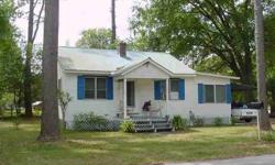 Located on a corner lot in the city limits this cute 2 bedroom, 1 bath can be a good rental or perfect first home. Covered front porch, attached carport and Florida room. A little TLC will go a long way on this home. For more information please contact