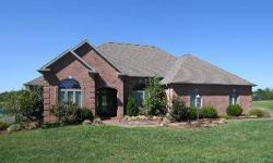 Absolutely gorgeous setting on 2.5 acres and a shared lake provides beautiful views for this fantastic 4-bedroom brick home with a generous open floor plan and split bedroom design. The stunning entry foyer creates a memorable impression the second you