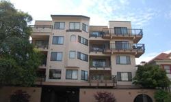 This charming corner unit condo has 2 bedrooms and 2 baths, hardwood floors in the living area, appliances, in-unit laundry, fireplace in the living room, an open floor plan, 2 decks and Lake Merritt views. This floor plan has the advantage of two