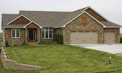Extraordinary custom built SE Polk acreage has too many features & upgrades to list. Open floor plan with 12 ceiling in family room & kitchen. Oversized kitchen features granite counters, rustic maple floors and soft close maple cabinets and drawers.