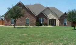 Lantrip custom home. Wylie. RV pad,fencing,grass,sprinkler,1.5 acres. STacked stone gas log fireplace,wood floors,picture windows. Open bar kitchen with stone,granite.Island,gas stove with pot filler.Oak cabinets.Master suite features; wood floors,jetted