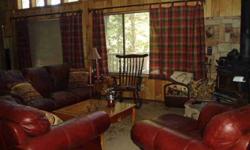 Cabin in the woods on half acre. Relax in the hot tub as you look back into the forest. Large cabin, vaulted ceilings, pool table; a perfect home away from home. The loft is large enough to be a den, TV room, office or even another bedroom. Open floor