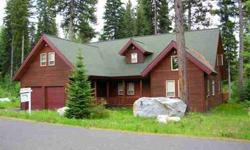 Spring Mountain Ranch showplace! Wonderful open floor plan with feeling of being in a mountain cabin. 4 Bedrooms/2 full baths with jetted tubs. Master on main floor. Upper loft has large living area and currently 4 rooms used for bedrooms. One large room