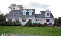 Charming 4 BR Cape Cod in Ellicott City. Cozy up in the winter in this spectacular living room with brick wall detailing. The upper level family room overlooks the main floor. Home feat h/wood floors, new carpet,1st floor Owner's Suite with full bath and