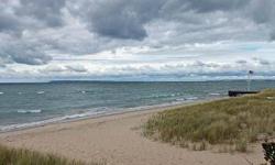 Large upper level Tall Timber 3 BR, 1.5 BA in one of the Homestead's most popular locations on the Crystal River, overlooking Lake Michigan, S. Manitou Island, Sleeping Bear Point and gorgeous sunsets. This favorite Leelanau County resort offers golf,