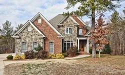Gorgeous brick and stone 5 bedroom w/3 car garage, private 1.77 acre lot on cul-de-sac. Loaded w/quality and upgrades. Vaulted great room w/fireplace that looks out to deck. Formal dining w/butlers pantry, huge open kitchen w/breakfast area. Deck from