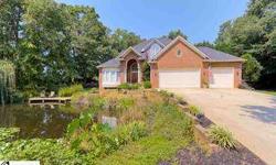 Super home with spring fed pond stocked with bass and bream on a cul-de-sac lot. The pond features a dock, fountain, and provides water for the irrigation system! Upgraded 4BR home w/3.5BAs, hardwood floors, tile baths, granite countertops, cabinets