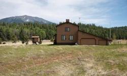 Less than 20 minutes from Flagstaff City limits to the opportunity you are dreaming of...This terrific mountain home backs National Forest lands with unobstructed views of the San Francisco Peaks. Located off the grid, this home is self-sufficient with