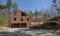 Looking for GREEN? Delightful private setting combines with easy access to major routes for this outstanding Windham contemporary. This 3+ acre lot is a mix of open and wooded areas, with a significant portion fenced. South facing side with abundant glass