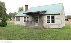 Two bedroom one bath, dining room, enclosed porch and two bonus rooms upstairs, a storage shed and storage building come with this cottage home on 1.39 Acres in nice community location.Listing originally posted at http