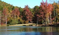 PRICED REDUCED FOR QUICK SALE -- SIMILAR TO LOTS ON THE SAME LAKE PRICED AT OVER $75,000. Lot 57 at the Summit is a gently sloping over 1/2 acre wooded lot with approx. 85 ft of lakefront . The Summit consists of 123 acres of wooded mountains overlooking