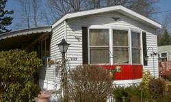14 X 70 mobile home. 2 large bedrooms with wall/wall closets, large living room in front with bay window, facing south (sun all day in winter) Aluminum siding,pitched roof, new last year. Regular storm windows. Easy to heat. Eat in kitchen with lots of